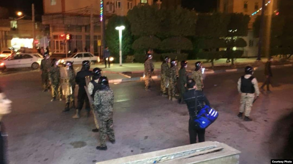 Police gather late on June 30 in the city of Khorramshahr.