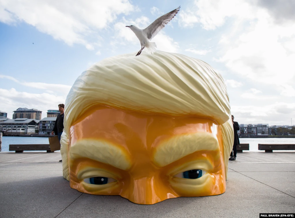 A sculpture called Helter Shelter, depicting U.S. President Donald Trump and created by artist Callum Morton, is seen as part of the Sydney Contemporary Art Fair preview at Barangaroo in Sydney, Australia. (EPA-EFE/Paul Braven)