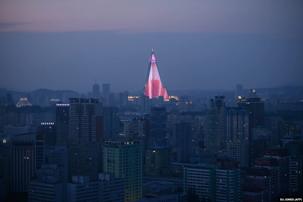 A light show is displayed on the Ryugyong hotel amid the city skyline of Pyongyang. North Korea is preparing to mark the 70th anniversary of its founding on September 9. (AFP/Ed Jones)