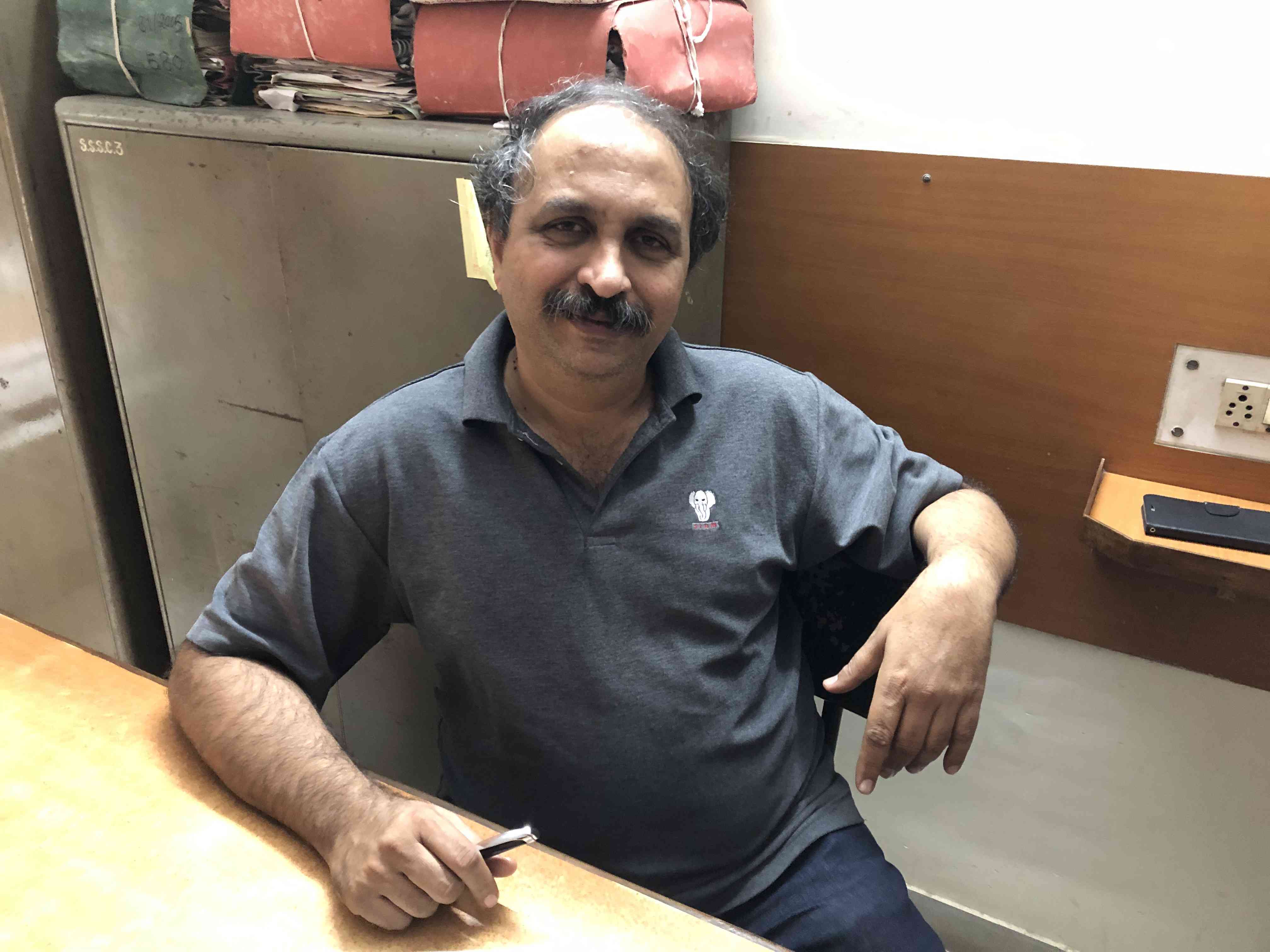Milind Ranade, general secretary of Kachra Vahtuk Shramik Sangh, in his union office in December. (Photo credit: Milind Ranade).