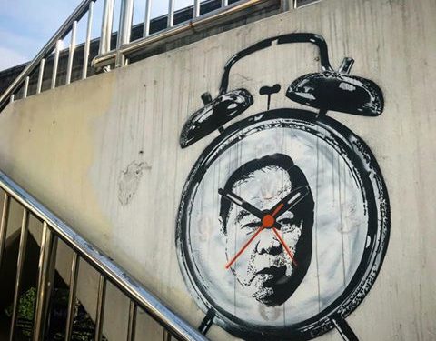 The artist ‘Headache Stencil’ uses graffiti to criticize military rule in Thailand